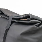 Close-up of a gray bag with a strap on a white background