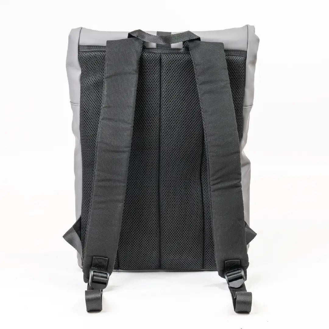 Back view of a gray backpack with black straps on a white background