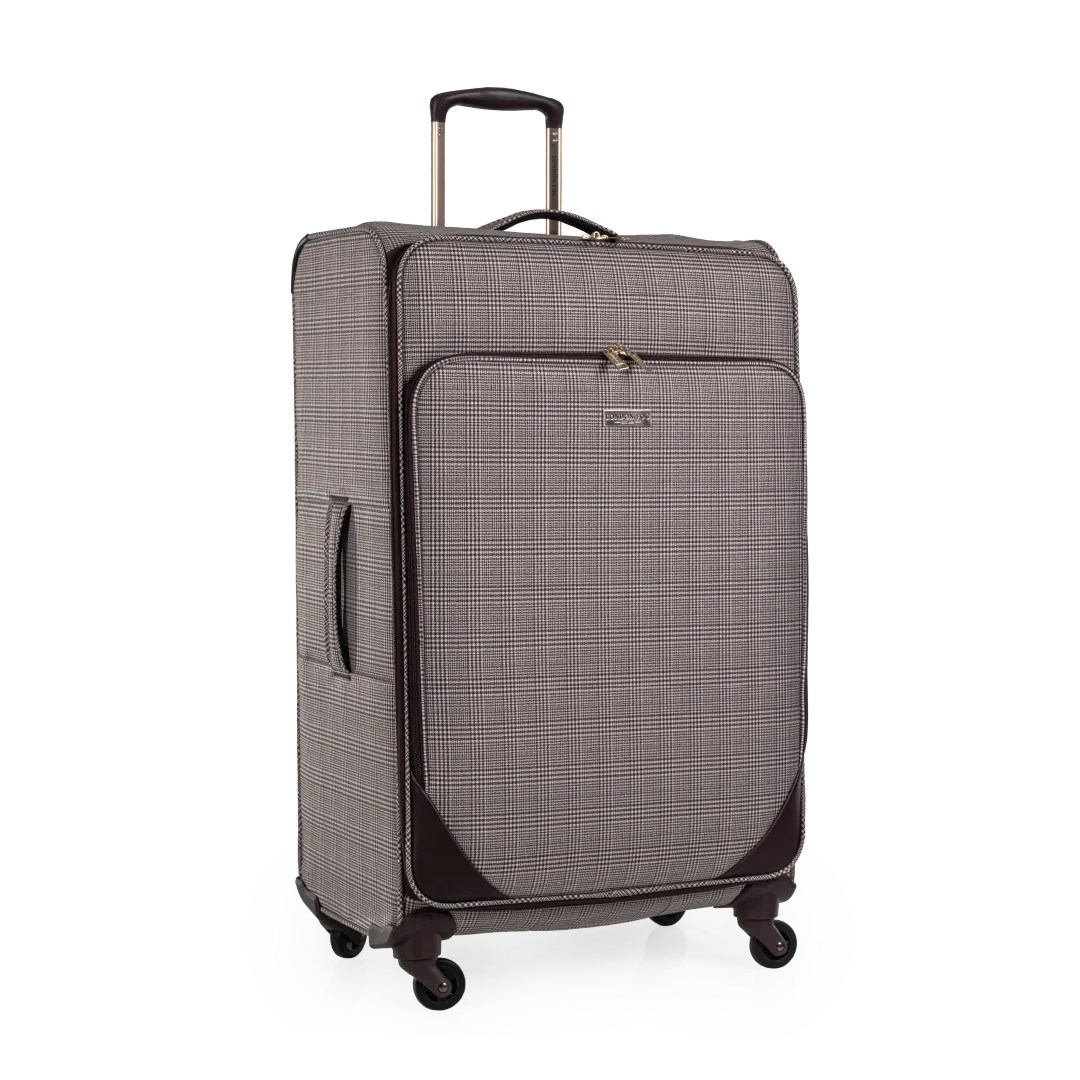 Checkered suitcase with wheels on a white background