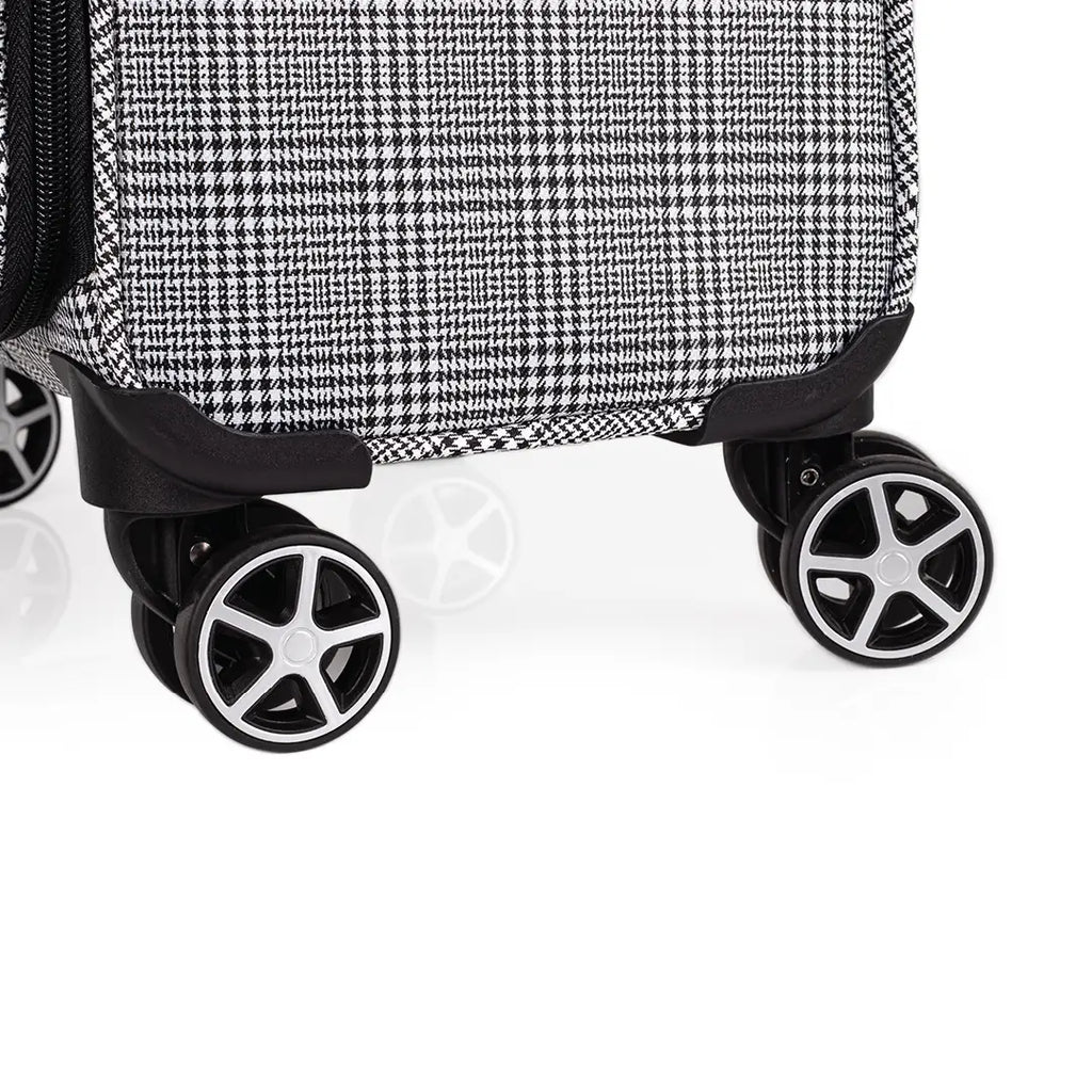 Close-up of a suitcase with wheels on a white background