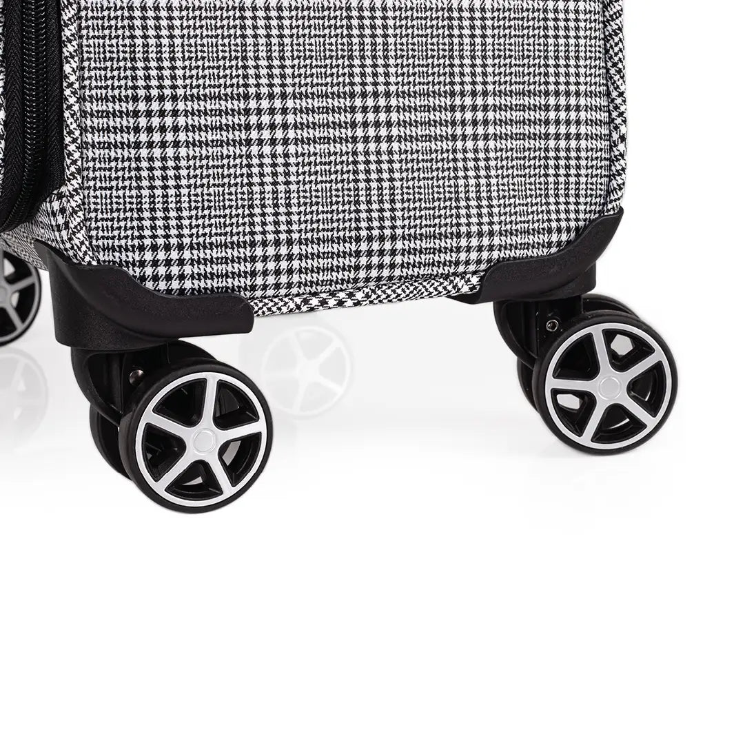 Close-up of a suitcase with wheels on a white background