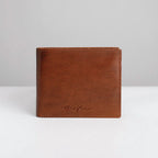 Brown leather wallet with brand logo on a white background